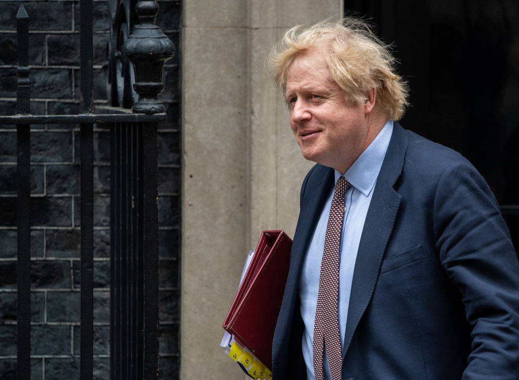 Still safe to return to work, Boris Johnson says, despite reopening pause