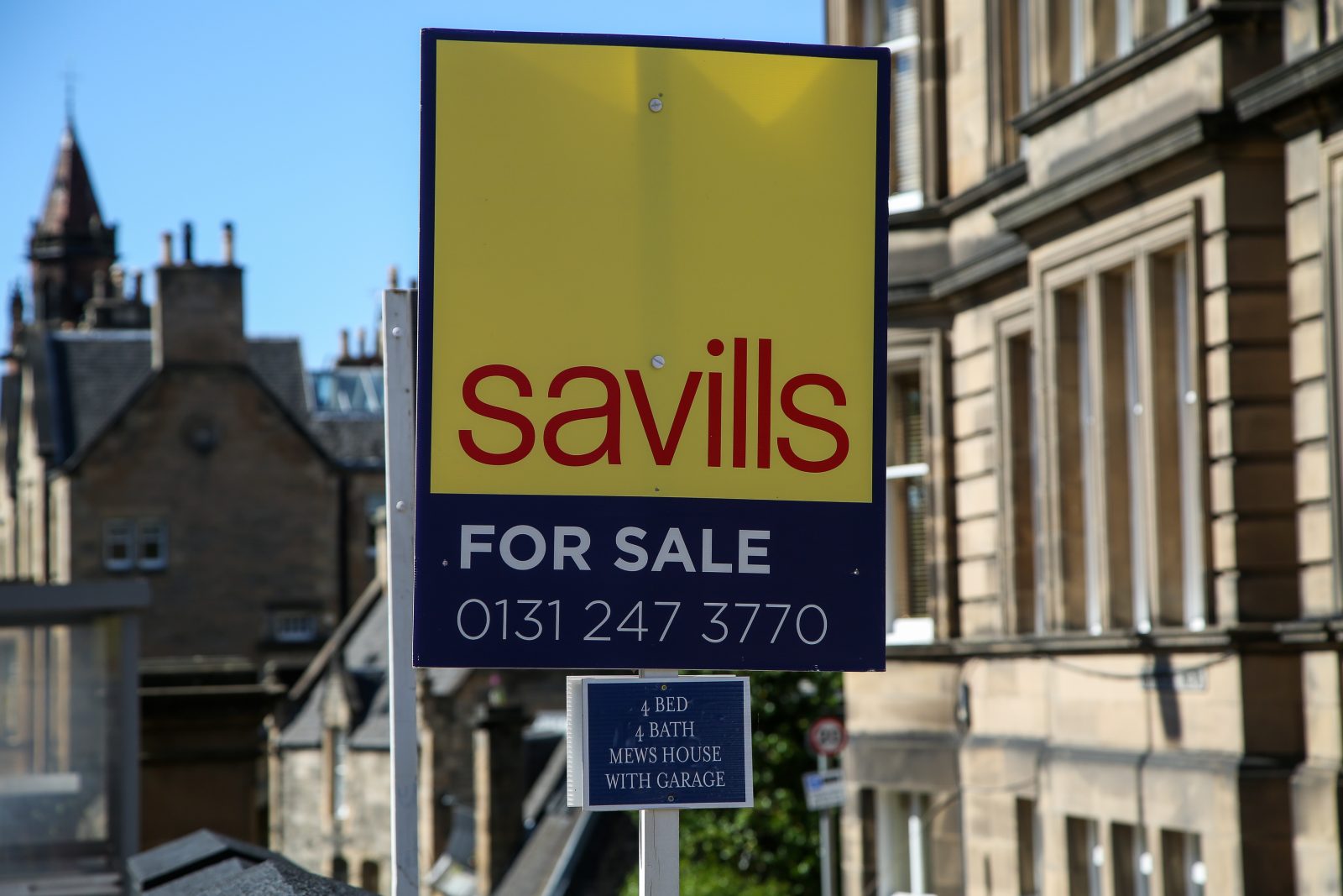 High-end estate agent Savills blames interest rates for profit crash