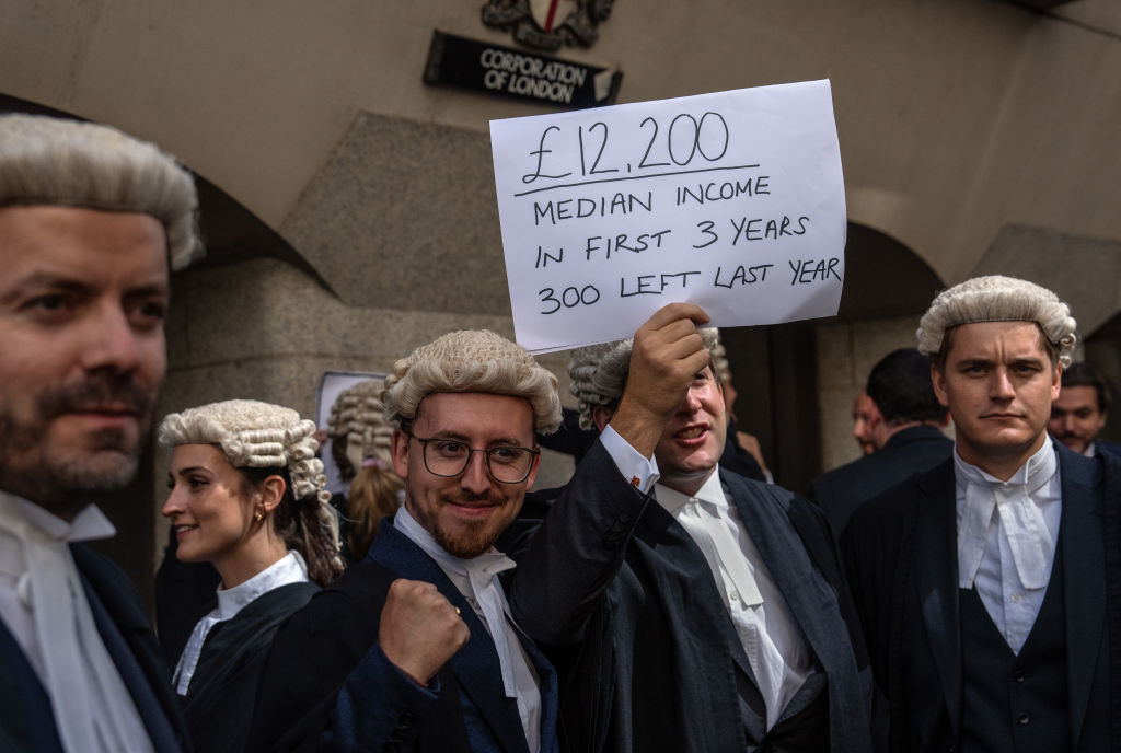 Defence barristers take part in a strike outside the Central Criminal Court, also known as the Old Bailey. 