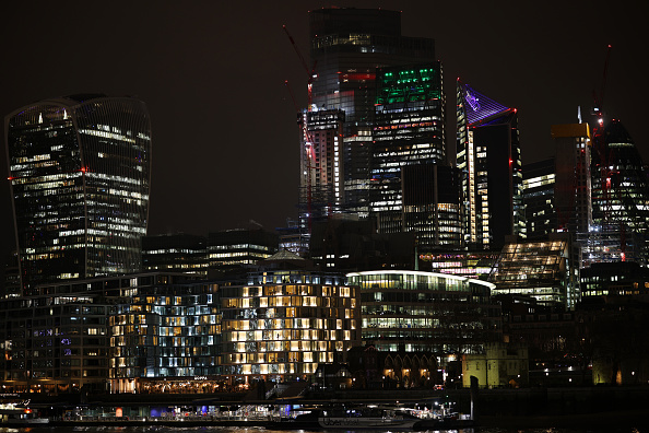 LONDON, ENGLAND - DECEMBER 16: General view of the City of London skyline at night following the announcement of an interest rate rise to 0.25% by the Bank of England, on December 16, 2021 in London, England.  (Photo by Dan Kitwood/Getty Images)