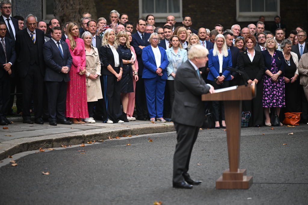 Conservative party members look on as British Prime Minister Boris Johnson delivers a farewell address before his official resignation at Downing Street earlier this morning 