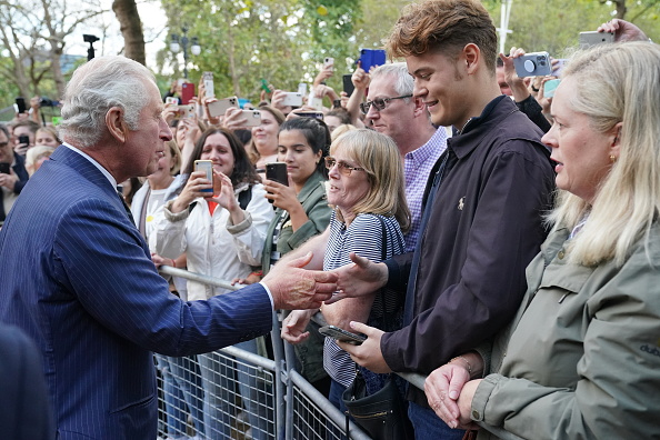 LONDON, ENGLAND - SEPTEMBER 10: King Charles III meets well-wishers as he returns to Clarence House from Buckingham Palace along the Mall during a impromptu walkabout following the death of Queen Elizabeth II on September 10, 2022 in London, United Kingdom. His Majesty The King is proclaimed at the Accession Council in the State Apartments of St James's Palace, London. The Accession Council, attended by Privy Councillors, is divided into two parts. In part I, the Privy Council, without The King present, proclaims the Sovereign and part II where The King holds the first meeting of His Majesty's Privy Council. The Accession Council is followed by the first public reading of the Principal Proclamation read from the balcony overlooking Friary Court at St James's Palace. The Proclamation is read by the Garter King of Arms, accompanied by the Earl Marshal, other Officers of Arms and the Serjeants-at-Arms. (Photo by Jonathan Brady - WPA Pool/Getty Images)