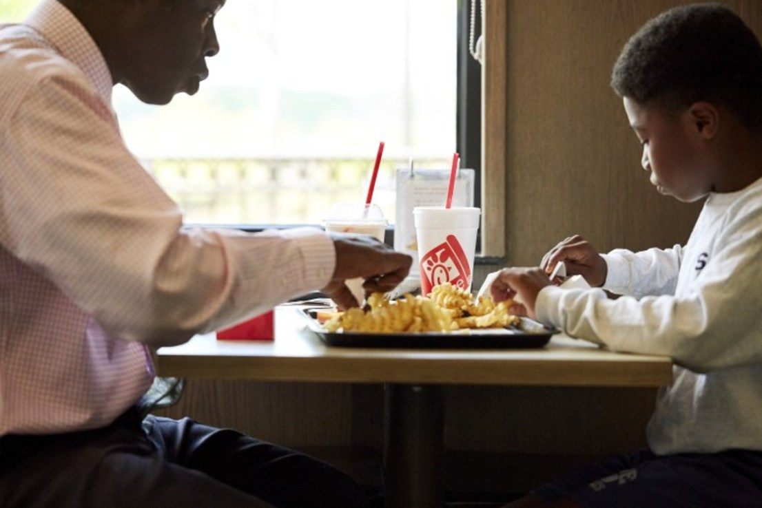 Two guests dining in at a Chick-fil-A restaurant