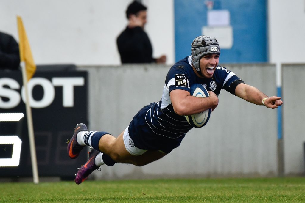 Agen's French fullback Clement Laporte jumps to score a try during the French Top 14 rugby union match between SU Agen and Brive on December 23, 2017 at the Armandie Stadium in Agen, southwestern France.   / AFP PHOTO / THIERRY BRETON        (Photo credit should read THIERRY BRETON/AFP via Getty Images)