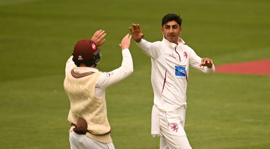 TAUNTON, ENGLAND - JULY 13: Shoaib Bashir of Somerset celebrates the wicket of Fletcha Middleton of Hampshire with team mate Tom Abell during Day Four of the LV= Insurance County Championship Division 1 match between Somerset and Hampshire at The Cooper Associates County Ground on July 13, 2023 in Taunton, England. (Photo by Harry Trump/Getty Images)