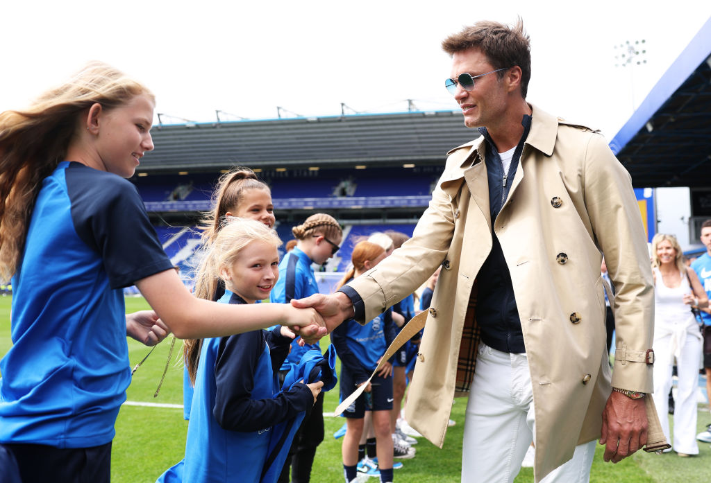 BIRMINGHAM, ENGLAND - AUGUST 12: Tom Brady, Former NFL Quarterback interacts with Birmingham City Mascots prior to the Sky Bet Championship match between Birmingham City and Leeds United at St Andrews (stadium) on August 12, 2023 in Birmingham, England. (Photo by Cameron Smith/Getty Images)