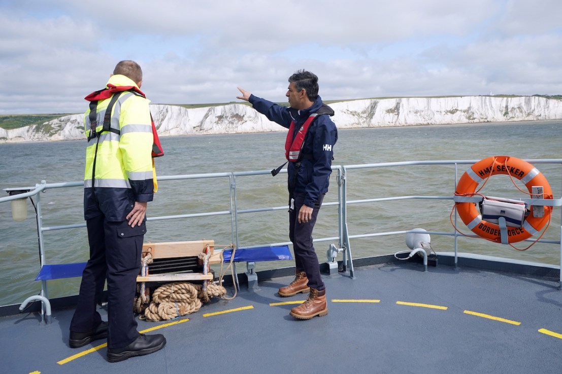 Yui Mok/PA Wire - Prime Minister Rishi Sunak speaking with director of Small Boats Operational Command (SBOC) Duncan Capps (left), onboard Border Agency cutter HMC Seeker