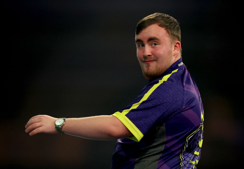 LONDON, ENGLAND - JANUARY 01: Luke Littler of England reacts during his quarter final match against Brendan Dolan of Ireland on day 14 of the 2023/24 Paddy Power World Darts Championship at Alexandra Palace on January 01, 2024 in London, England. (Photo by Tom Dulat/Getty Images)