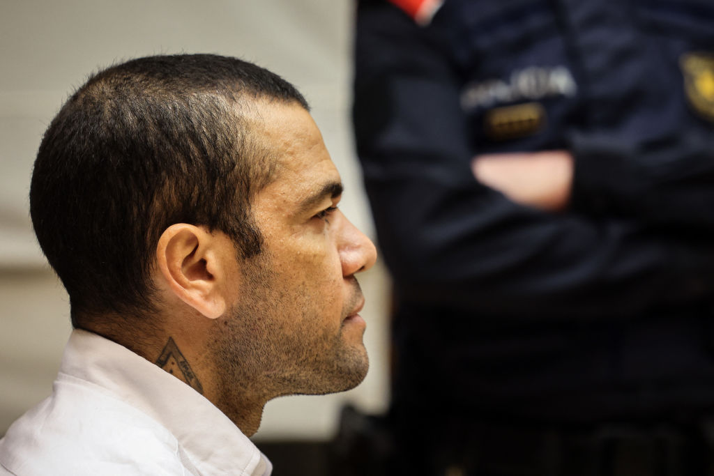 Brazilian footballer Dani Alves looks on at the start of his trial at the High Court of Justice of Catalonia in Barcelona, on February 5, 2024. Brazilian footballer Dani Alves, a former star at Barca and PSG, goes on trial in Barcelona accused of raping a woman in a local nightclub. Prosecutors are asking for a nine-year prison sentence, followed by 10 years of conditional liberty. They are also asking he pay 150,000 euros ($162,000) in compensation to the woman. (Photo by Jordi BORRAS / POOL / AFP) (Photo by JORDI BORRAS/POOL/AFP via Getty Images)