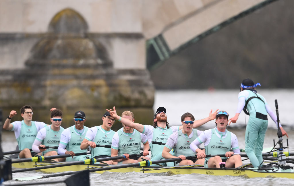 LONDON, ENGLAND - MARCH 26:  (Bow Seat) Matt Edge, Nick Mayhew, Noam Mouelle, Brett Taylor, Thomas Lynch, Seb Benzeery, Ollie Parish, (Stroke Seat) Luca Ferraro and Coxswain Jasper Parish of Cambridge University Boat Club celebrate after defeating Oxford University Men's Boat Club during The Gemini Boat Race 2023 on March 26, 2023 in London, England.  (Photo by Alex Davidson/Getty Images)