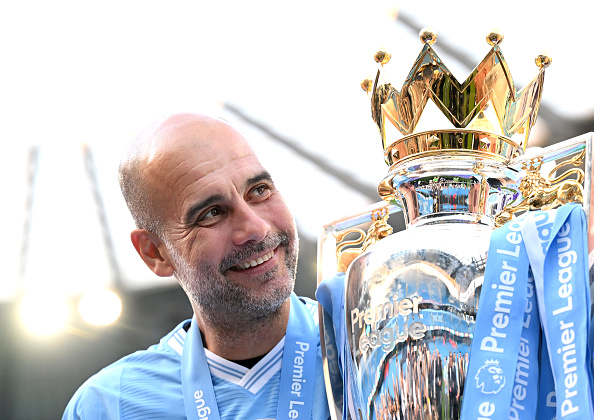 MANCHESTER, ENGLAND - MAY 19: Pep Guardiola, Manager of Manchester City, poses for a photo with the Premier League title trophy following the team's victory in the Premier League match between Manchester City and West Ham United at Etihad Stadium on May 19, 2024 in Manchester, England. (Photo by Michael Regan/Getty Images)