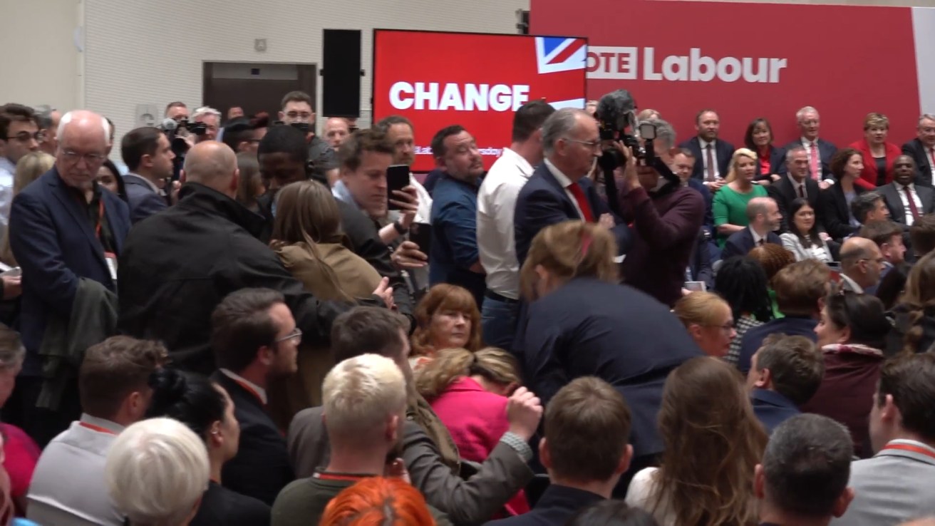 A screen grab taken from PA Video of a heckler being ejected as Labour Party leader Sir Keir Starmer launches his party's manifesto at Co-op HQ in Manchester. Picture date: Thursday June 13, 2024. PA Photo. See PA story POLITICS Election. Photo credit should read: Shivansh Gupta/PA Video/PA Wire