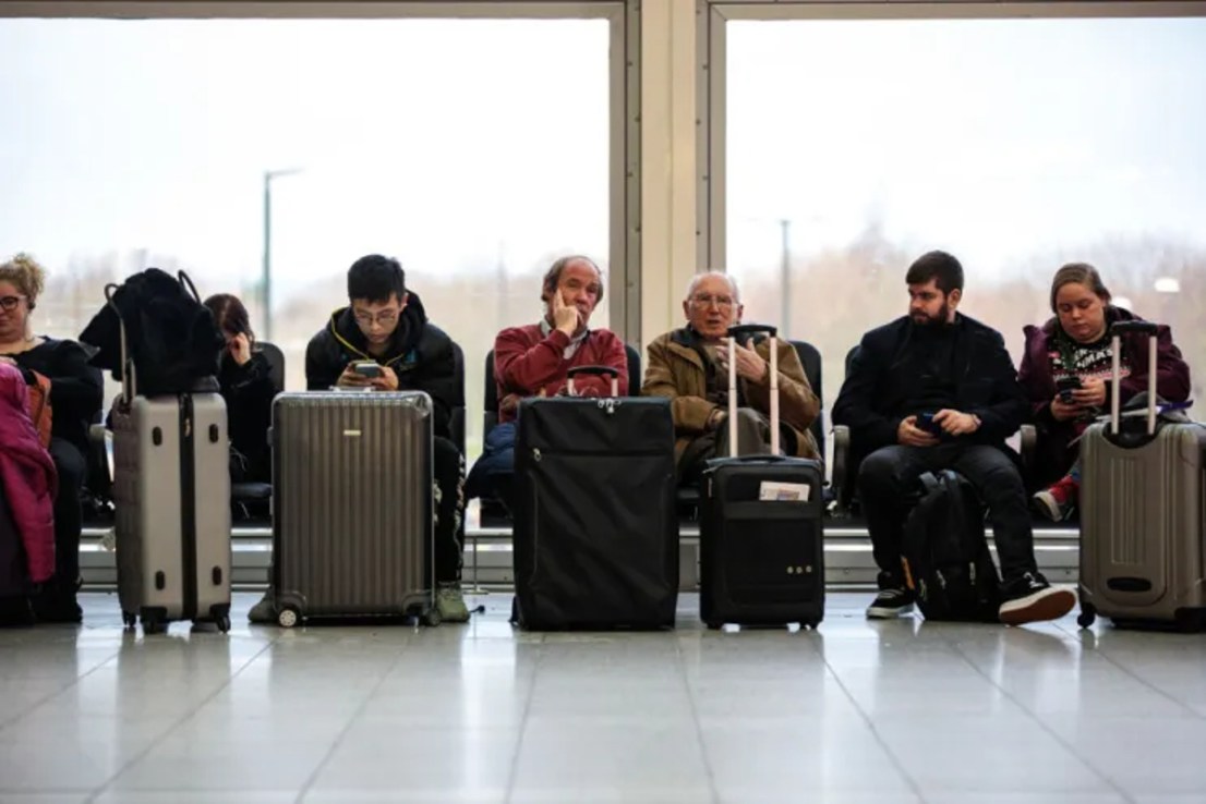 Passengers wait at an airport. (Photo by Jack Taylor/Getty Images)