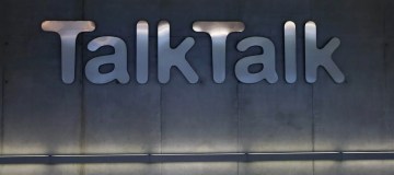 Talktalk's logo lit up on a concrete wall