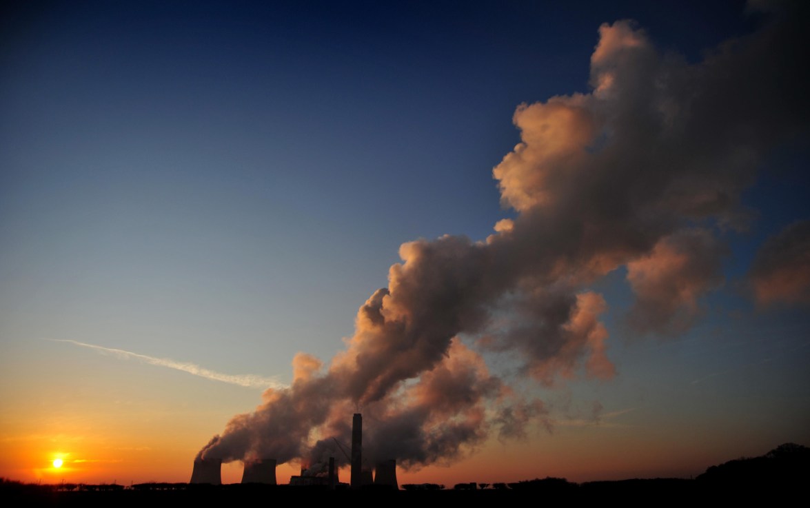 The sun setting over Ratcliffe-on-Soar Power Station near Nottingham. The UK's last remaining coal-fired power station is to shut at the end of September, drawing to a close Britain's 142-year reliance on the fossil fuel to produce electricity. Photo Credit: Matthew Vincent/PA Wire