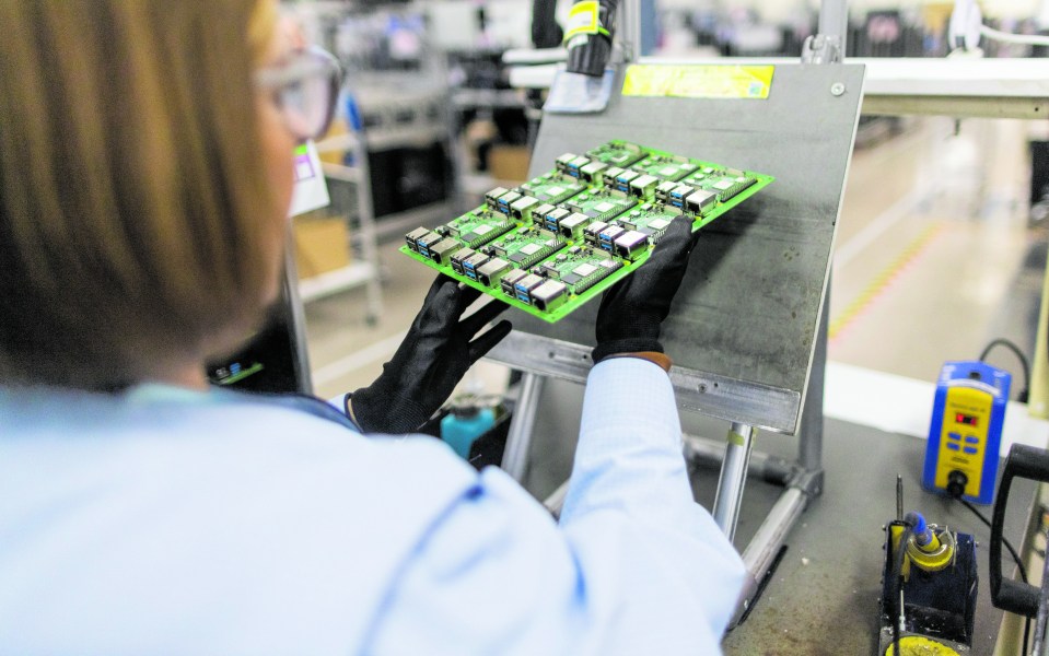 An employee performs quality control checks on Raspberry Pi personal computers on the production line at the Sony UK Technology Centre in Pencoed, UK,  . Photographer: Chris Ratcliffe/Bloomberg via Getty Images