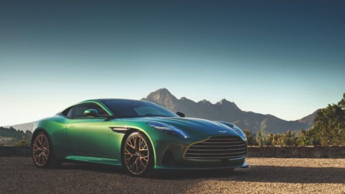 Aston Martin on Monday issued a profit warning, downgrading guidance for the year ahead and slashing its car production target by around 1,000.