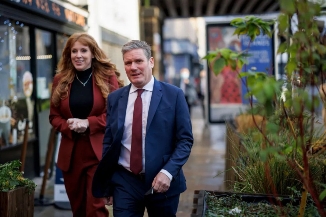 Angela Rayner, who is overseeing the workers' rights reforms, and Keir Starmer walking down a street