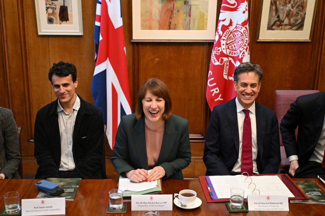 LONDON, ENGLAND - JULY 9: UK Chancellor of the Exchequer Rachel Reeves (C) laughs next to her special adviser Neil Amin-Smith (L) after Britain's Climate Change and Net Zero Secretary Ed Miliband (R) made a joke about the long wait to have a woman chancellor during a meeting of the National Wealth Fund Taskforce at 11 Downing Street on July 9, 2024 in London, England. The National Wealth Fund Taskforce revealed plans behind the new national wealth fund set up to catalyse private sector investment in new and in-growing industries. (Photo by Justin Tallis - WPA Pool/Getty Images)