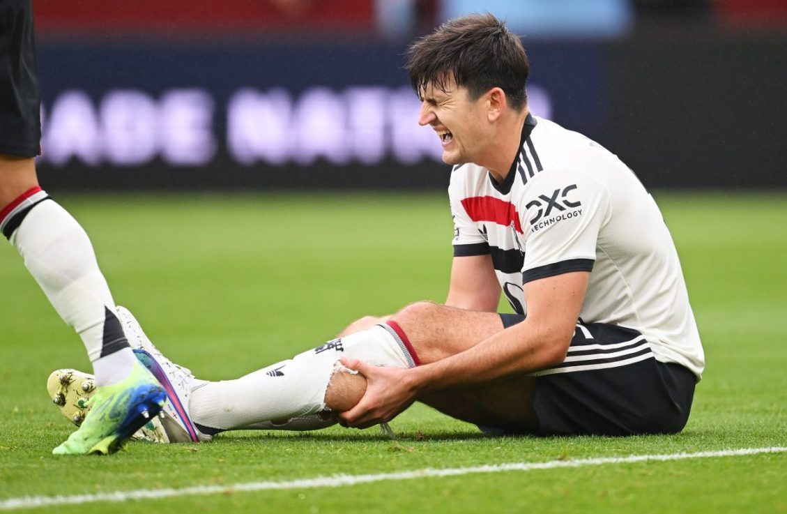 BIRMINGHAM, ENGLAND - OCTOBER 06: Harry Maguire of Manchester United reacts following an injury during the Premier League match between Aston Villa FC and Manchester United FC at Villa Park on October 06, 2024 in Birmingham, England. (Photo by Michael Regan/Getty Images)