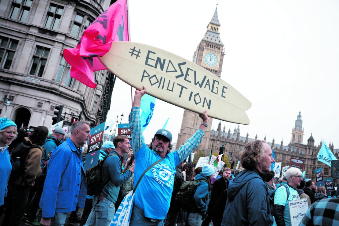 Campaigners protest against the water industry outside the Houses of Parliament