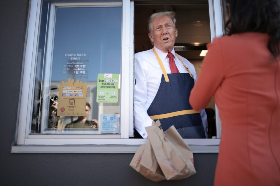 FEASTERVILLE-TREVOSE, PENNSYLVANIA - OCTOBER 20: Republican presidential nominee, former U.S. President Donald Trump answers questions as he works the drive-through line during a campaign photo op as he visits a McDonald's restaurant on October 20, 2024 in Feasterville-Trevose, Pennsylvania. Trump is campaigning the entire day in the state of Pennsylvania. Trump and Democratic presidential nominee Vice President Kamala Harris continue to campaign in battleground swing states ahead of the November 5th election. (Photo by Win McNamee/Getty Images)