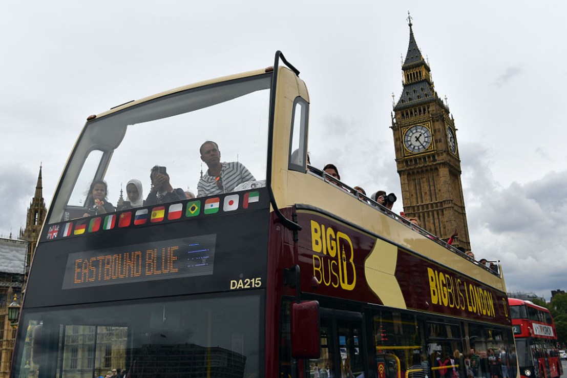 The company behind London Big Bus Tours has significantly cuts its pre-tax loss. (Photo by Carl Court/Getty Images)