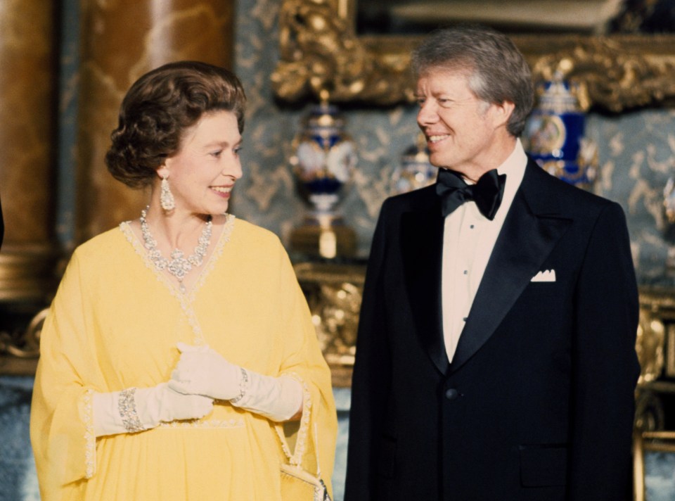 Queen Elizabeth II with the then US President Jimmy Carter at a State Dinner at Buckingham Palace in London. Photo credit should read: PA Wire