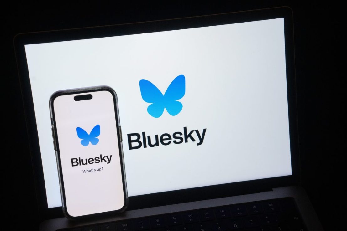 LONDON, ENGLAND - NOVEMBER 22: In this photo illustration, the Bluesky social media platform logo is displayed on an iPhone and laptop screen on November 22, 2024 in London, England. The social media app Bluesky has seen its user base increase by over 5.5 million since the U.S. Presidential elections as some people leave rival X, which is owned by Elon Musk. (Photo by Carl Court/Getty Images)