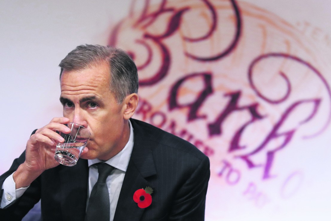 Former governor of the Bank of England, Mark Carney, takes a drink during the quarterly Inflation Report press conference at The Bank of England in London on November 3, 2016.(/ AFP / POOL / Kirsty Wigglesworth        (Photo credit should read KIRSTY WIGGLESWORTH/AFP/Getty Images)