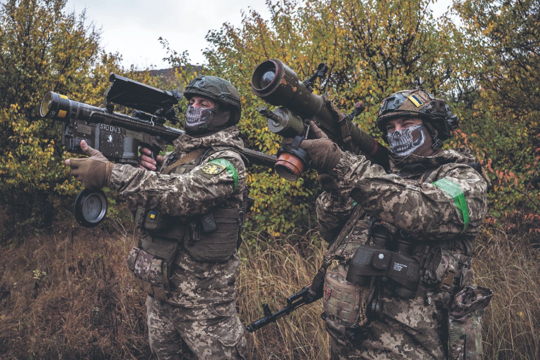 Two Ukrainian soldiers check the scopes of their anti-aircraft systems to ensure they're working properly before heading out on a mission in Donetsk Oblast, Ukraine  (Photo by Fermin Torrano/Anadolu via Getty Images)