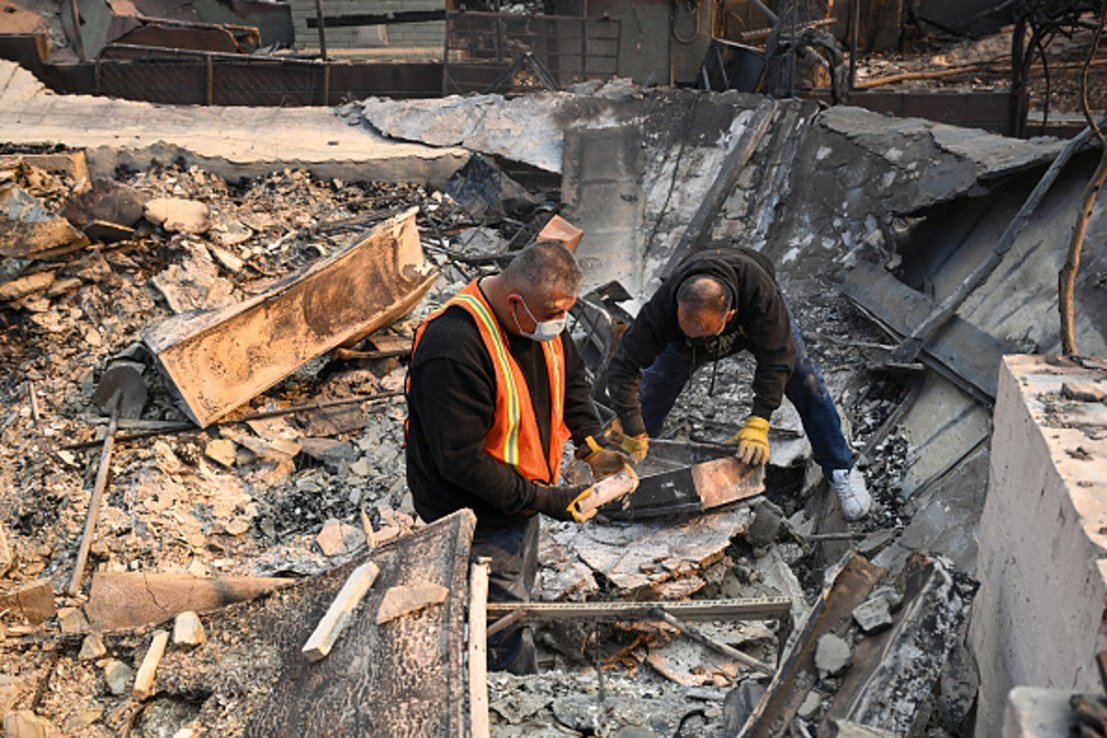 Residents search for valuables among the rubbles of their burnt houses during Eaton wildfire in Altadena of Los Angeles County, California, United States on January 9, 2025.  . (Photo by Tayfun Coskun/Anadolu via Getty Images)